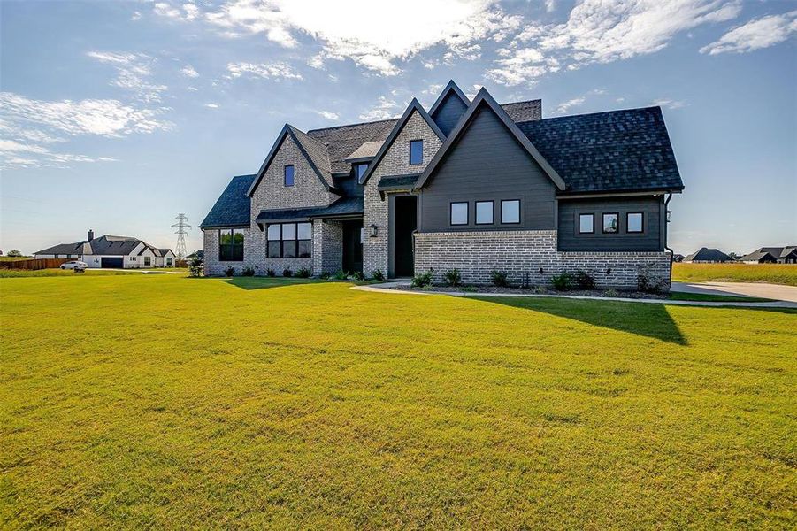 View of front of house with a front lawn