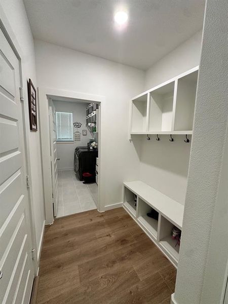 Mudroom with wood finished floors