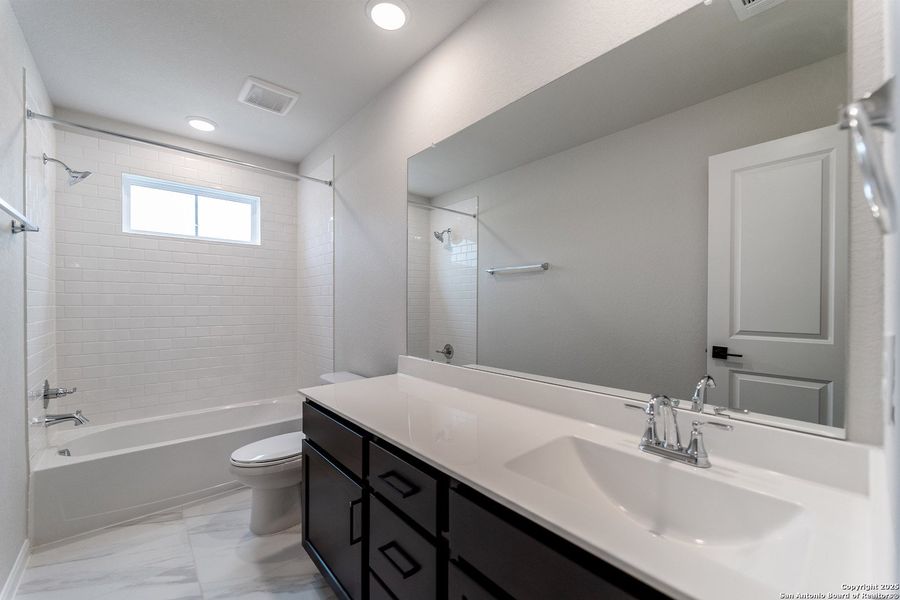 Furnished interior view inside a new home in The Woodlands at Medina Hills, Mico (Image 8).