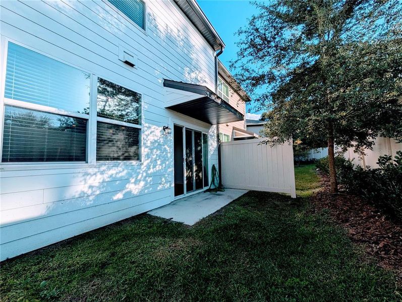 Exterior details and patio area of a home in Tyson Townhomes, Zephyrhills (Image 19). Exterior details and patio area of a home in Tyson Townhomes, Zephyrhills (Image 19).