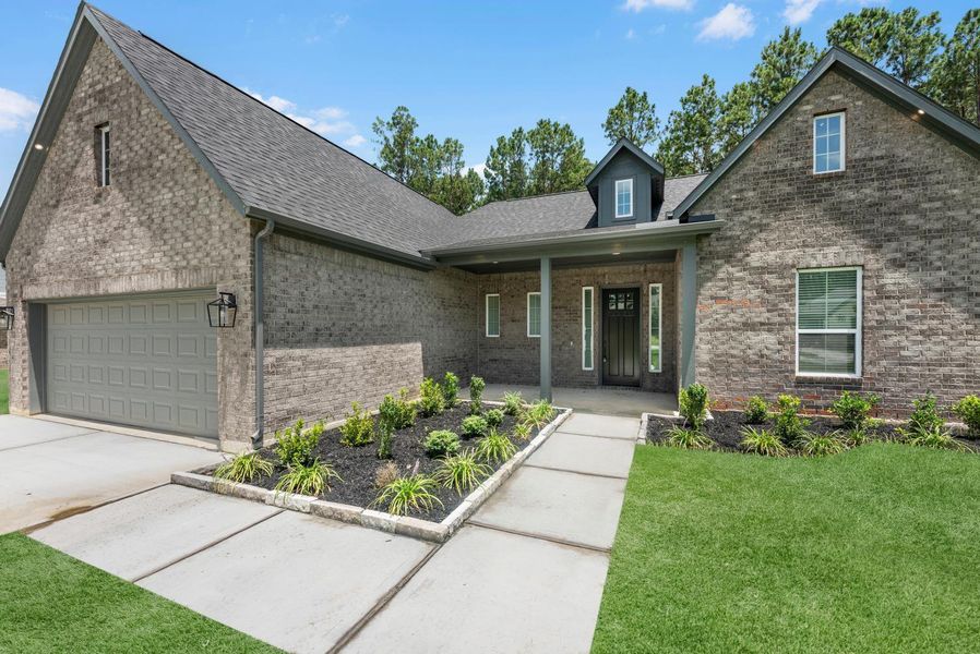 Front exterior of a new home in , Dayton, TX, highlighting curb appeal (Image 20).