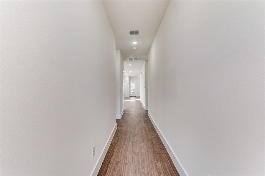 Hallway featuring hardwood / wood-style flooring