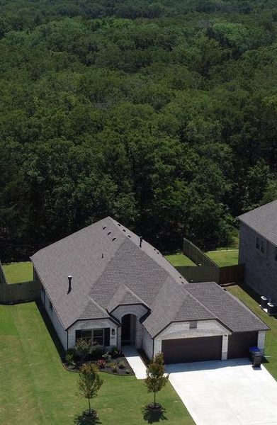 Front exterior of a new home in , Greenville, TX, highlighting curb appeal (Image 20).