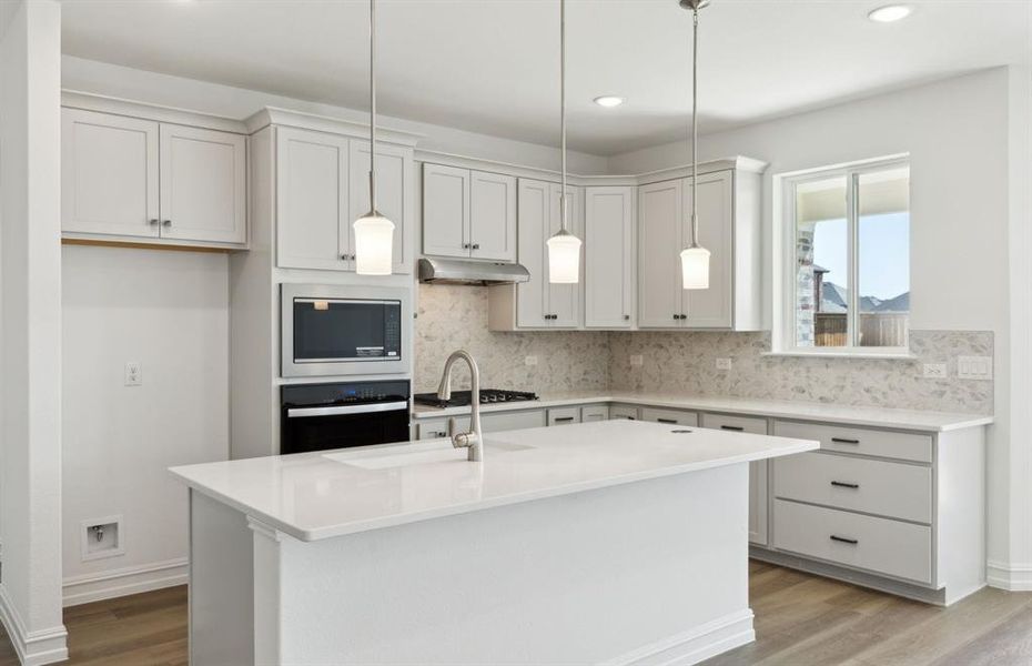 Kitchen featuring a large island ideal for informal dining and gatherings *Real home pictured Kitchen featuring a large island ideal for informal dining and gatherings *Real home pictured