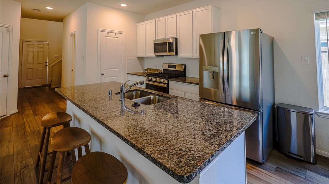 Furnished interior view inside a new home in Woodshore, Clute (Image 7).