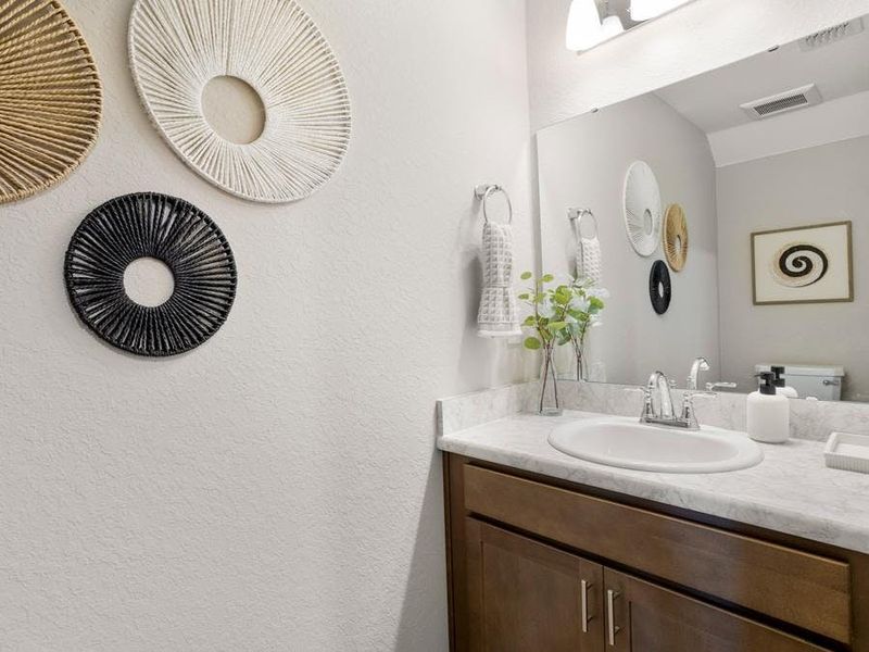 And, a downstairs powder room serves your guests - Isla townhome by Highland Homes