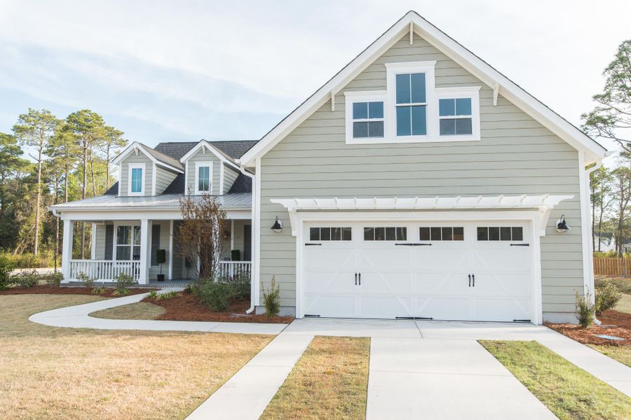 Representative exterior photo of a completed home built from the McKinley by Bill Clark Homes in The Sanctuary at Sunset Beach, Sunset Beach, NC (Image 28). Representative exterior photo of a completed home built from the McKinley by Bill Clark Homes in The Sanctuary at Sunset Beach, Sunset Beach, NC (Image 28).