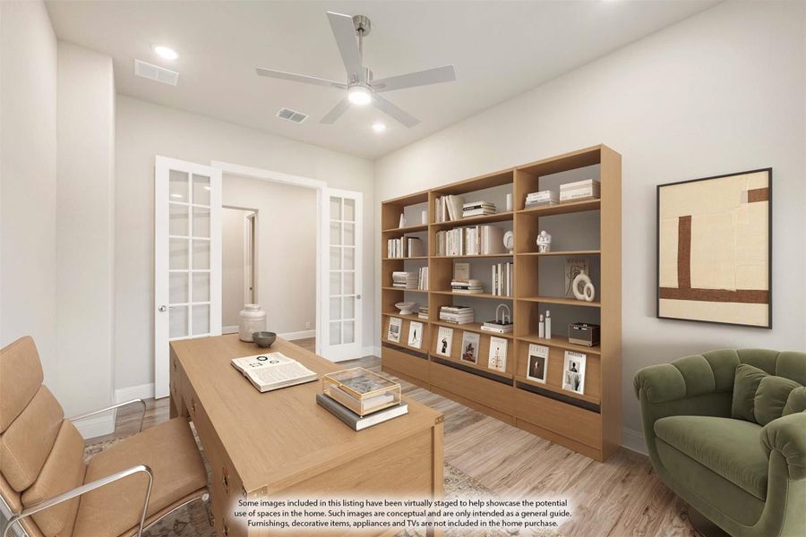 Home office with wood desk, built-in bookshelf, ceiling fan, and French doors