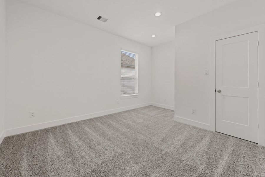 Representative unfurnished interior of a home built from the Rollins by Chesmar Homes in Gregg Ranch, Marble Falls (Image 12).