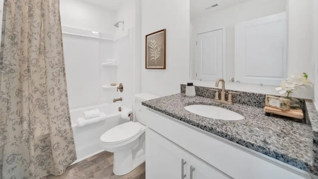 Representative furnished interior of a home built from the Mitchell Townhome by D.R. Horton in Oak Vista, Knoxville (Image 24).