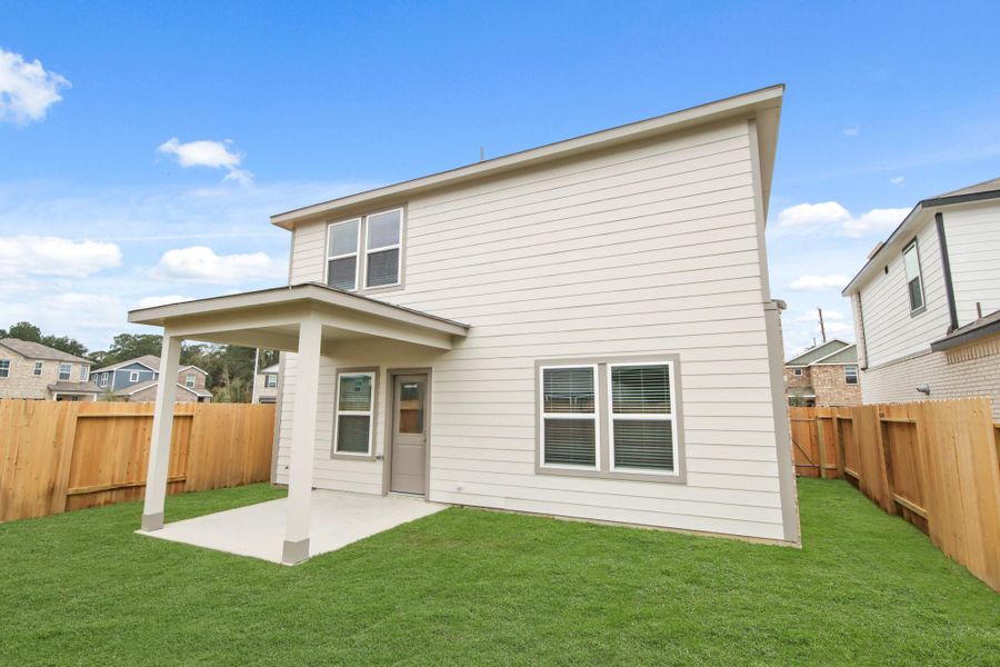 Exterior details and patio area of a home in Lakes at Black Oak, Magnolia (Image 15).