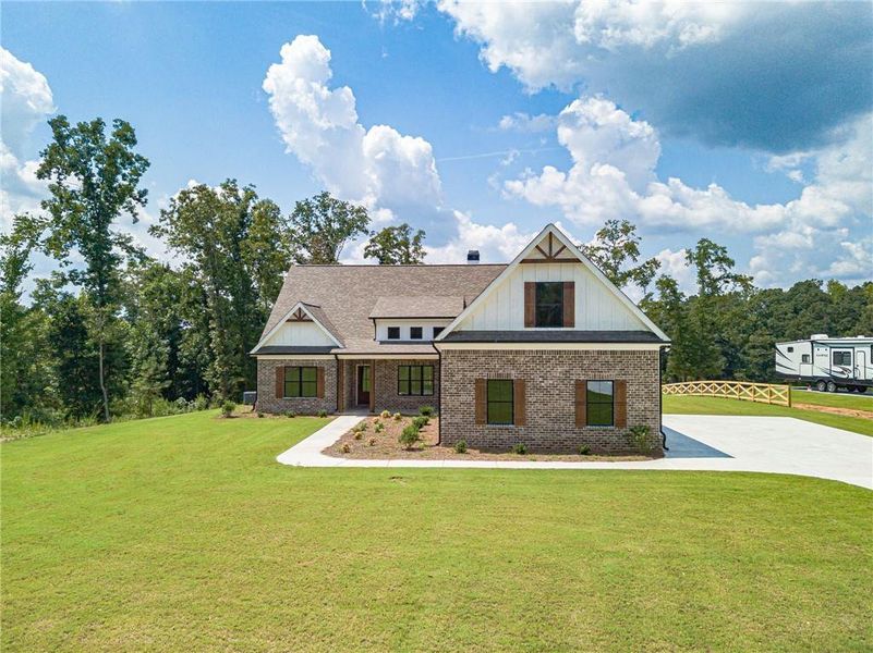 Front exterior of a new home in , Monroe, GA, highlighting curb appeal (Image 2). Front exterior of a new home in , Monroe, GA, highlighting curb appeal (Image 2).