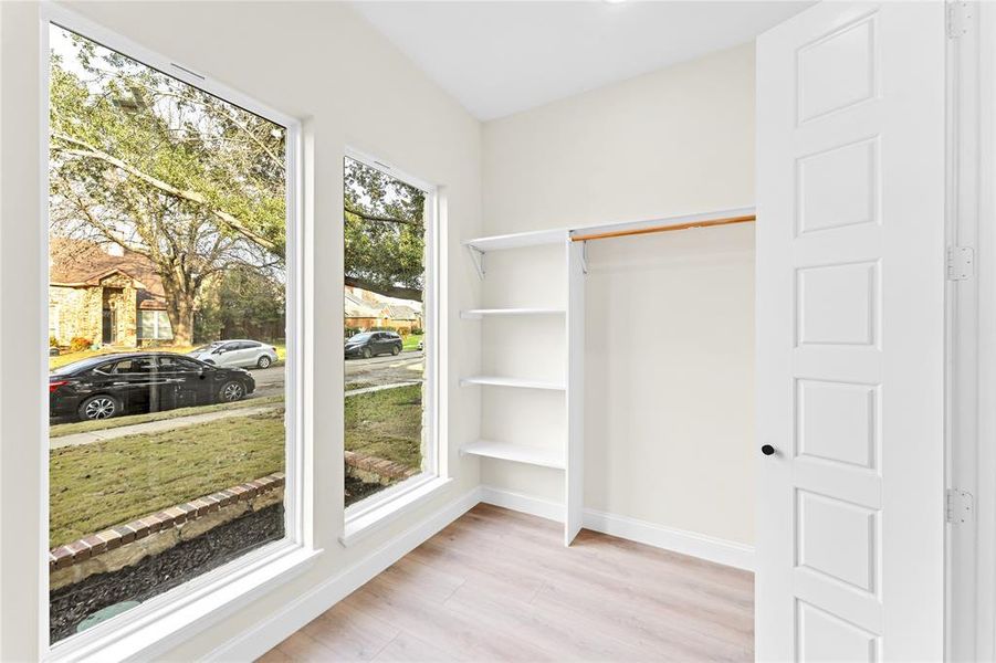 Walk in closet featuring light hardwood / wood-style flooring