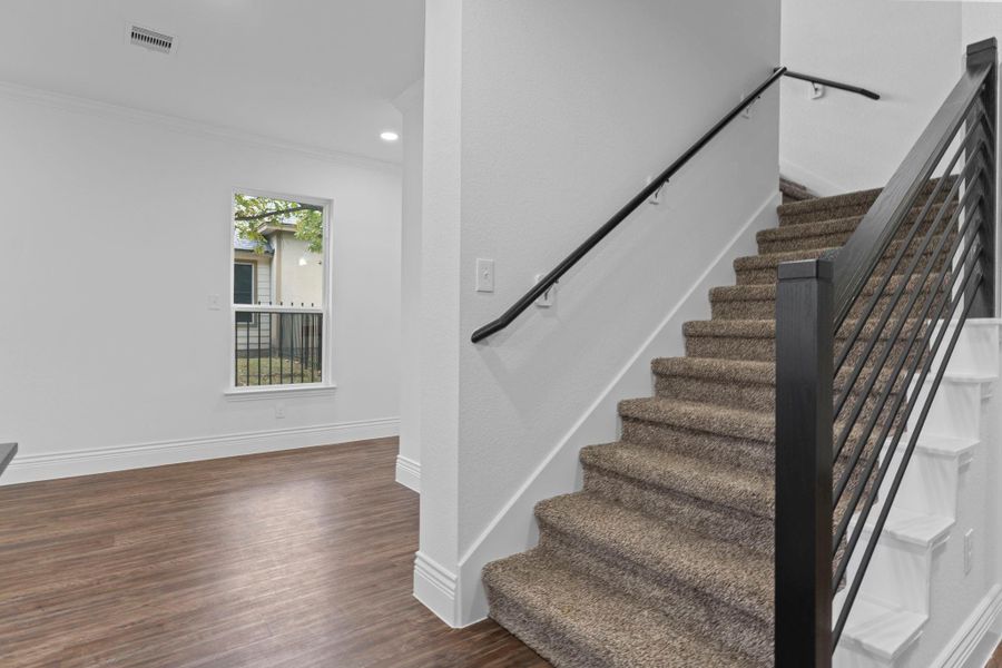 The chic modern iron stairway feels so elegant with its clean lines and gentle rise to the second floor. It gives the home a graceful transition between spaces and feels wonderfully open. The chic modern iron stairway feels so elegant with its clean lines and gentle rise to the second floor. It gives the home a graceful transition between spaces and feels wonderfully open.