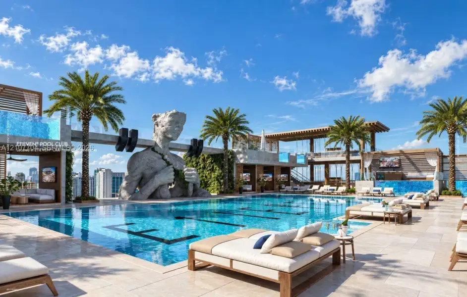 Rooftop swimming pool featuring large-scale sculptural elements, limestone-finish decking, integrated palm tree landscaping, and overhead wood-slat structures