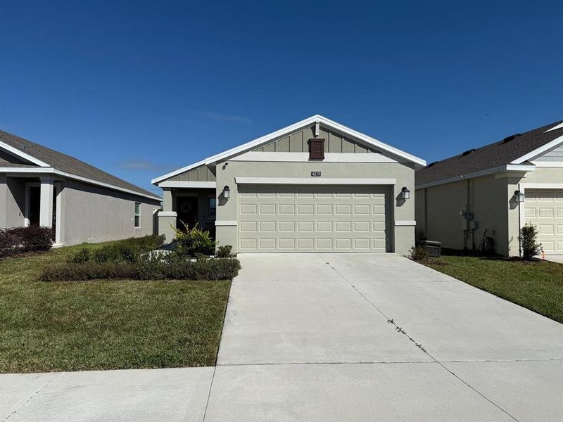 Front exterior of a new home in , Kissimmee, FL, highlighting curb appeal (Image 2).