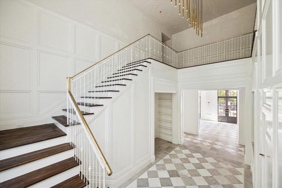 Additional view of the staircase and beautiful wood flooring that leads to the second floor.