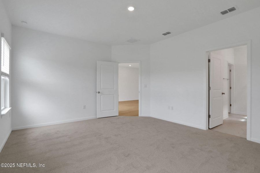 Spacious, unfurnished interior of a new home in TrailMark, St. Augustine (Image 42).