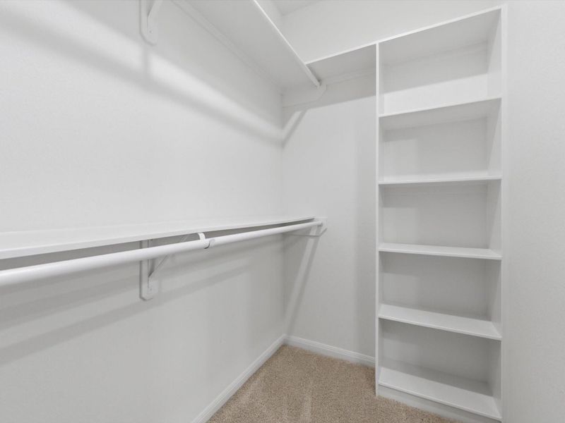 The expansive primary walk-in closet is thoughtfully designed with built-in storage, offering both convenience and everyday ease.