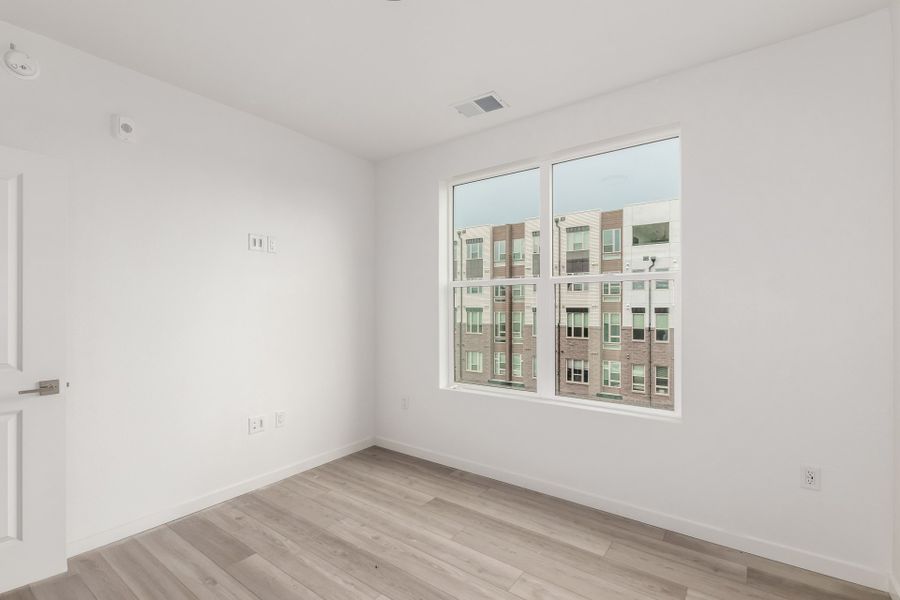 Spacious, unfurnished interior of a new home in The Scene at Sloan's Lake, Denver (Image 12).