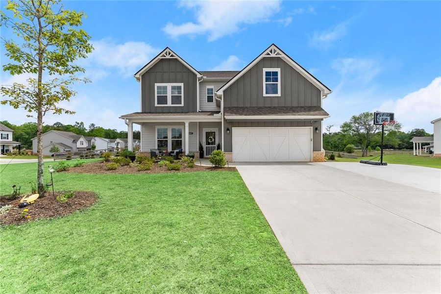 Front exterior of a new home in , Dacula, GA, highlighting curb appeal (Image 26).