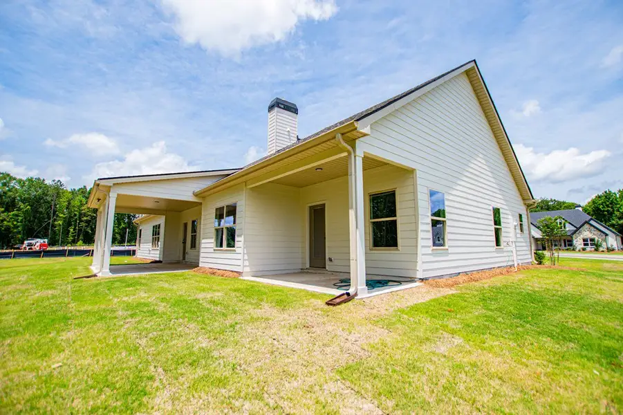 Exterior details and patio area of a home in WOODMONT RESERVE, Roopville (Image 33).