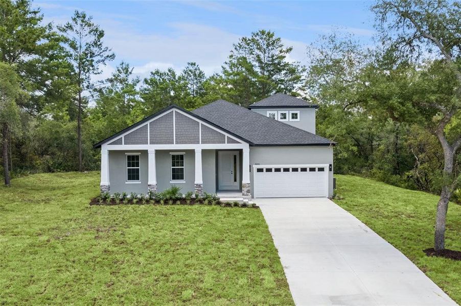 Front exterior of a new home in , Eustis, FL, highlighting curb appeal (Image 25). Front exterior of a new home in , Eustis, FL, highlighting curb appeal (Image 25).