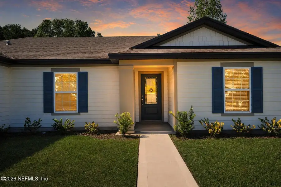 Front exterior of a new home in Palm Coast, Palm Coast, FL, highlighting curb appeal (Image 2). Front exterior of a new home in Palm Coast, Palm Coast, FL, highlighting curb appeal (Image 2).