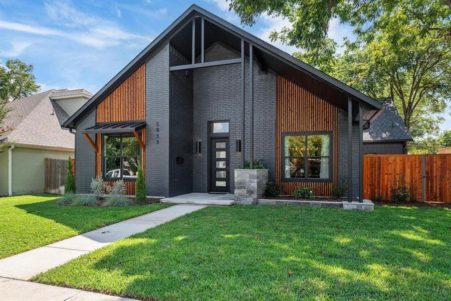 Contemporary house featuring brick siding Contemporary house featuring brick siding