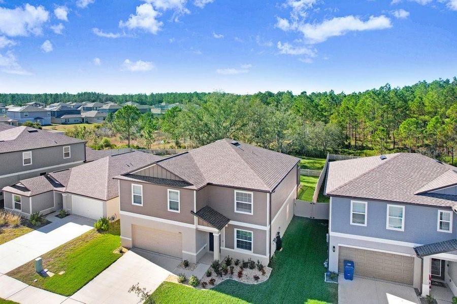 Front exterior of a new home in , Zephyrhills, FL, highlighting curb appeal (Image 1). Front exterior of a new home in , Zephyrhills, FL, highlighting curb appeal (Image 1).