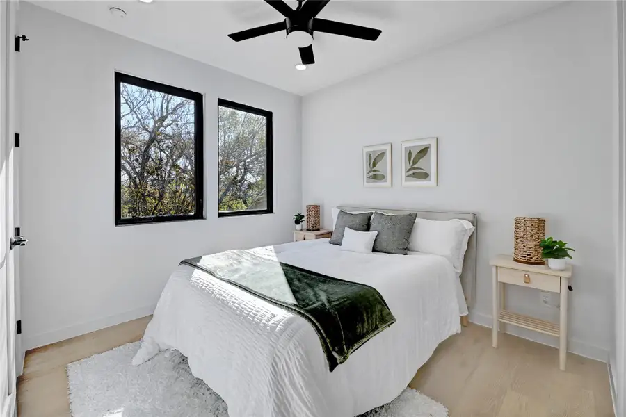 Bedroom featuring recessed lighting, baseboards, light wood-style floors, and ceiling fan