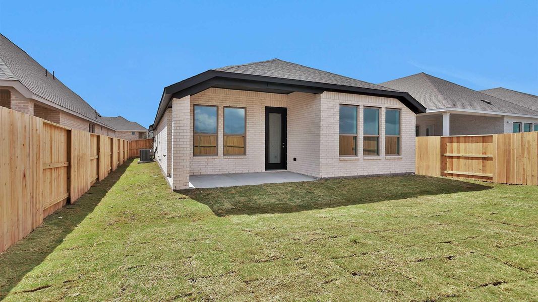 Exterior details and patio area of a home in Meridiana, Manvel (Image 3).