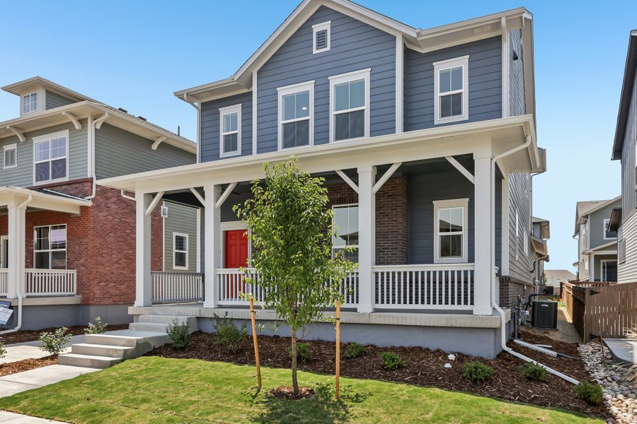 Front exterior of a new home in Painted Prairie Cottage, Aurora, CO, highlighting curb appeal (Image 26). Front exterior of a new home in Painted Prairie Cottage, Aurora, CO, highlighting curb appeal (Image 26).