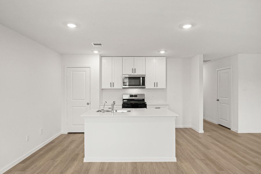 Furnished interior view inside a new home in Sunterra, Katy (Image 8).