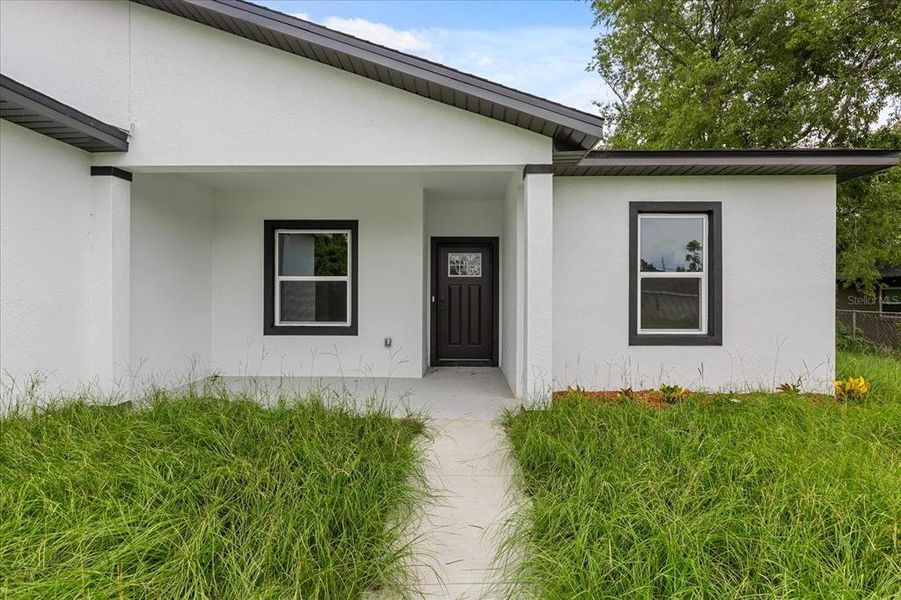 Front exterior of a new home in , Ocala, FL, highlighting curb appeal (Image 21). Front exterior of a new home in , Ocala, FL, highlighting curb appeal (Image 21).