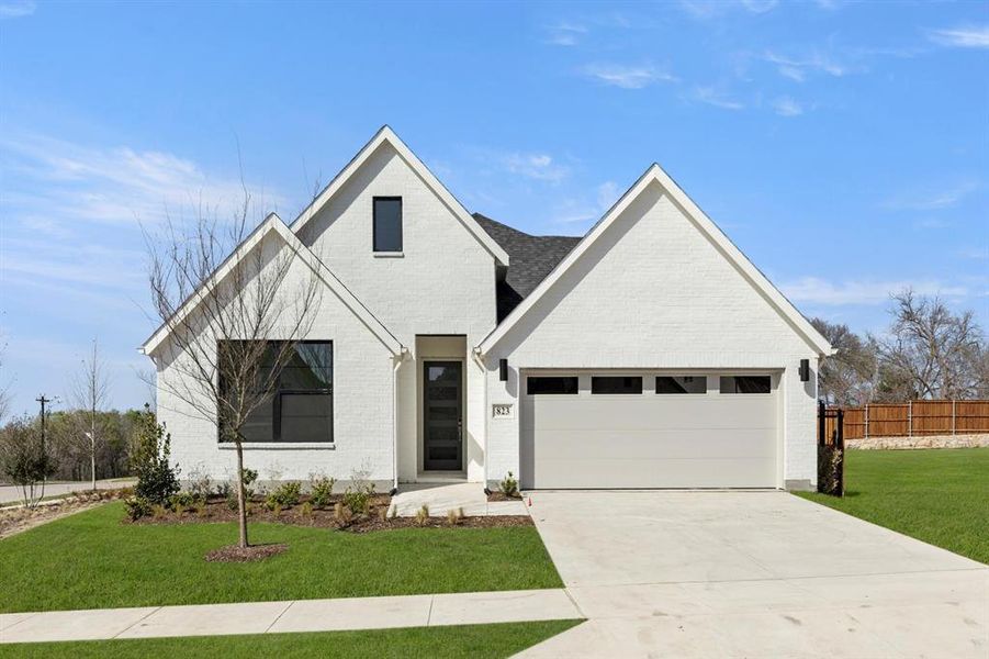 Front exterior of a new home in Hillstead, Lavon, TX, highlighting curb appeal (Image 2).