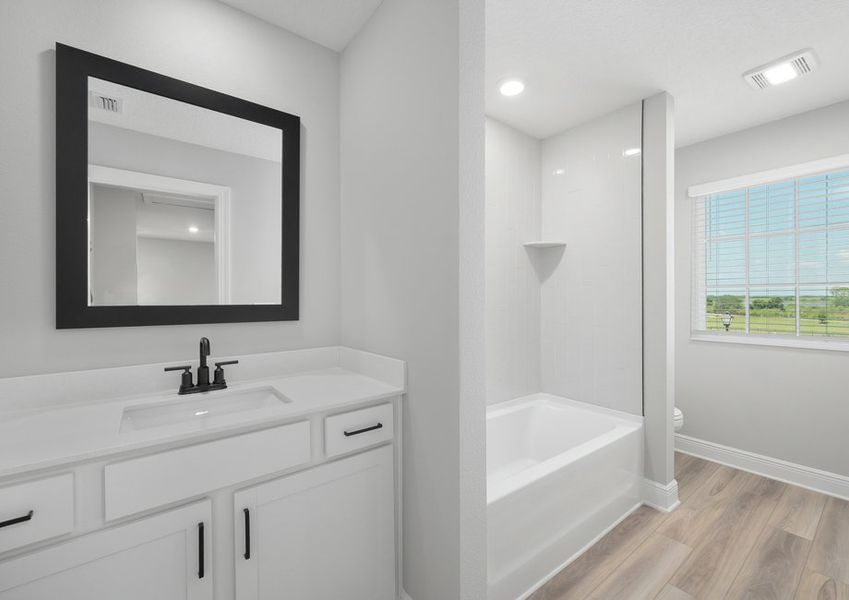 The secondary bathroom comes includes a shower tub combo with a spacious vanity. The secondary bathroom comes includes a shower tub combo with a spacious vanity.