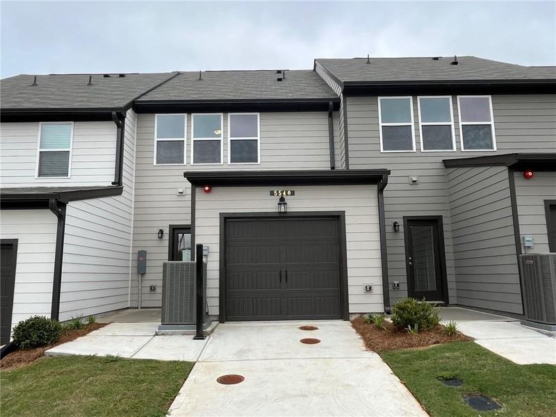 Front exterior of a new home in Laurelwood, Douglasville, GA, highlighting curb appeal (Image 16).
