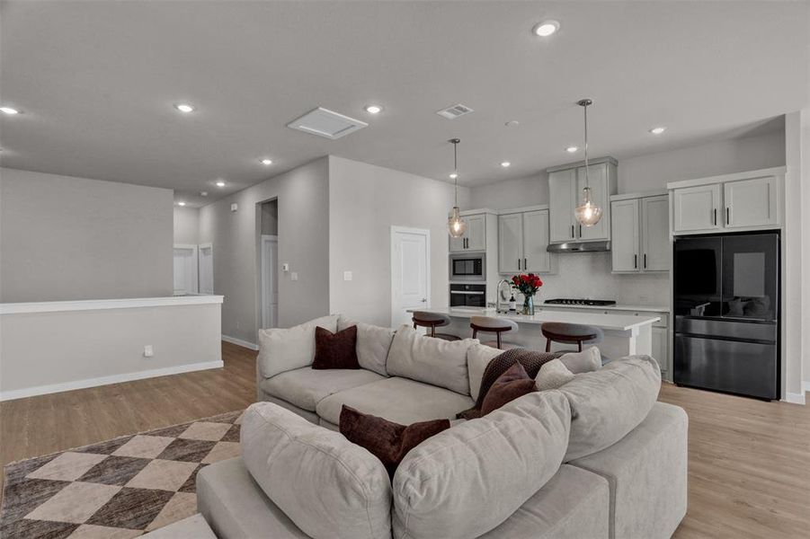 Whether you prefer a cozy lounge setup or a more formal dining moment, the open layout makes it easy to define each space with furniture while still maintaining an airy, connected flow. Whether you prefer a cozy lounge setup or a more formal dining moment, the open layout makes it easy to define each space with furniture while still maintaining an airy, connected flow.