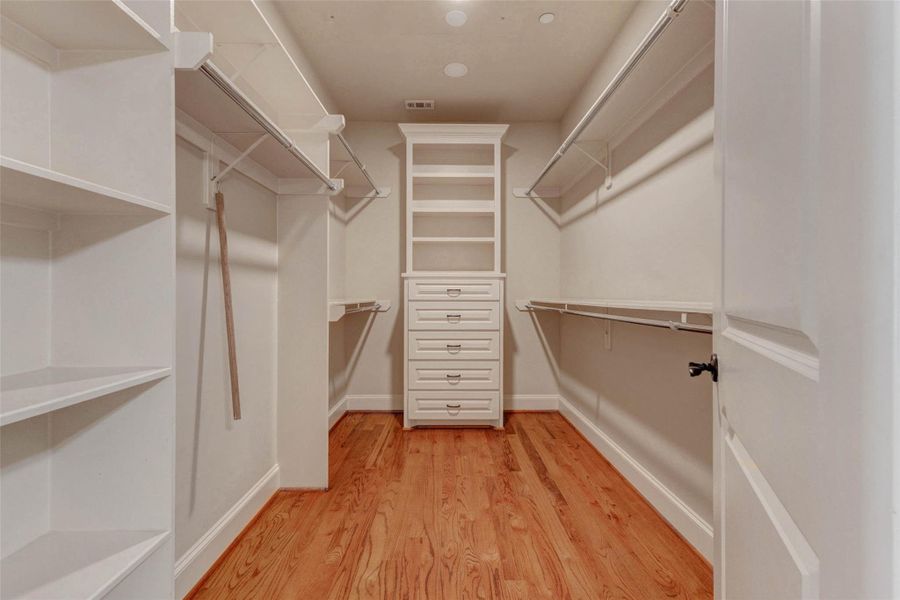 ONE OF TWO LARGE WALK-IN CLOSETS IN PRIMARY SUITE