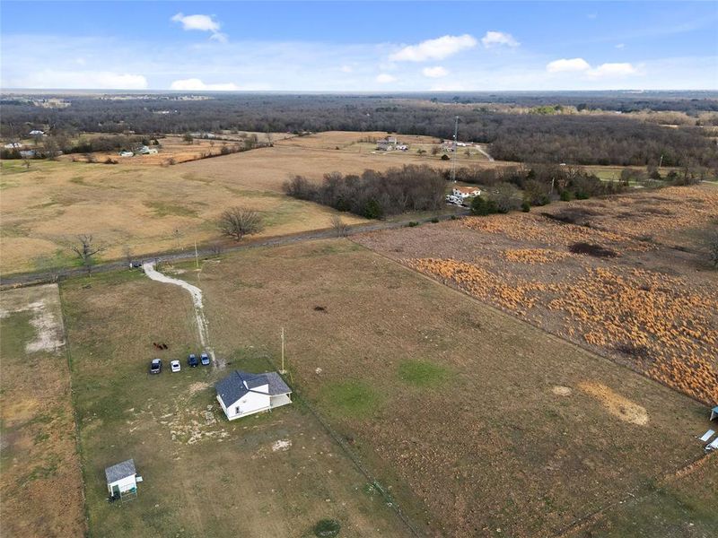 Aerial view of property's location with rural landscape