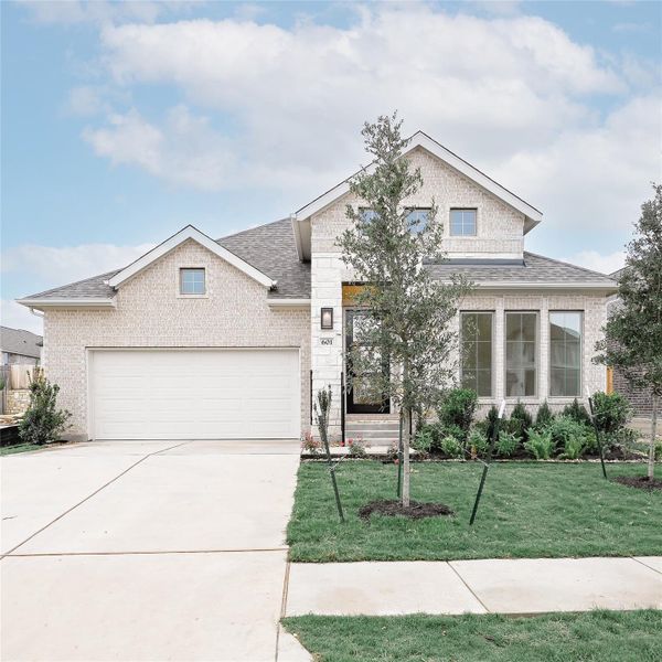 Front exterior of a new home in Crosswinds, Kyle, TX, highlighting curb appeal (Image 2).