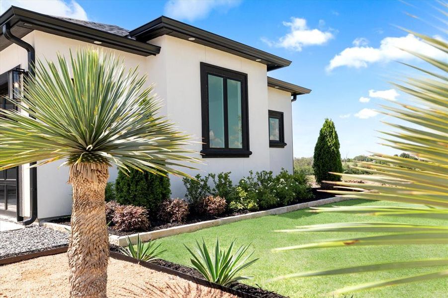 View of side of home with stucco siding