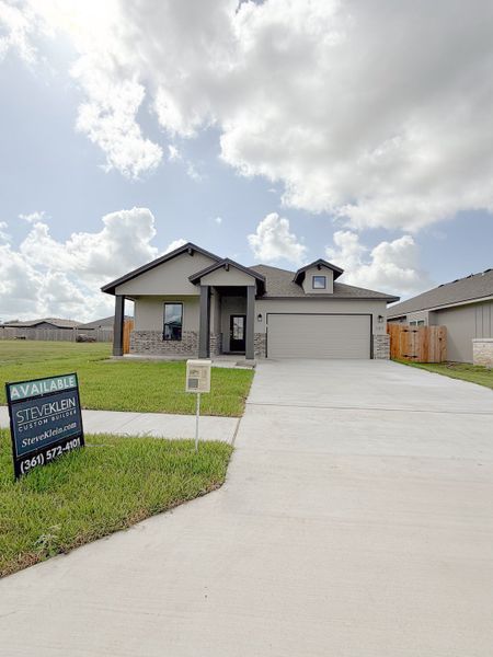 Front exterior of a new home in TerraVista, Victoria, TX, highlighting curb appeal (Image 31).