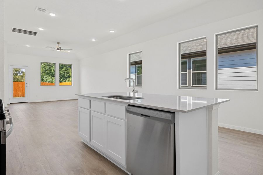 Kitchen in the Elm home plan by Trophy Signature Homes – REPRESENTATIVE PHOTO