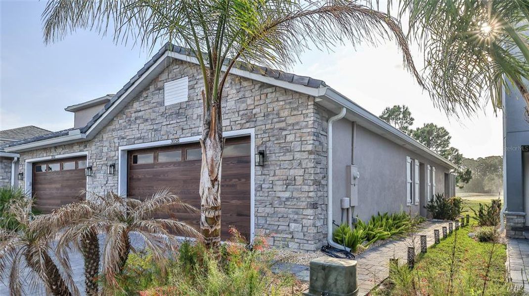 Front exterior of a new home in , New Smyrna Beach, FL, highlighting curb appeal (Image 1). Front exterior of a new home in , New Smyrna Beach, FL, highlighting curb appeal (Image 1).