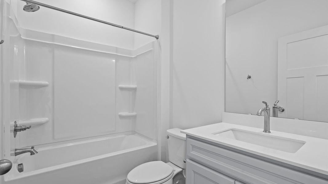 Elegant bath retreat with designer finishes and a clean, timeless aesthetic