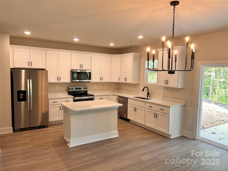 Furnished interior view inside a new home in , Lenoir (Image 3).