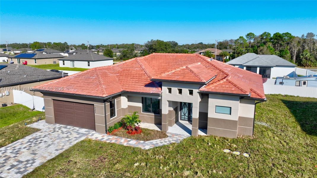 Front exterior of a new home in , Fort Myers, FL, highlighting curb appeal (Image 17).