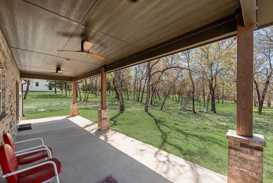 Huge Back Covered Porch with ceiling fans, custom lighting and more!